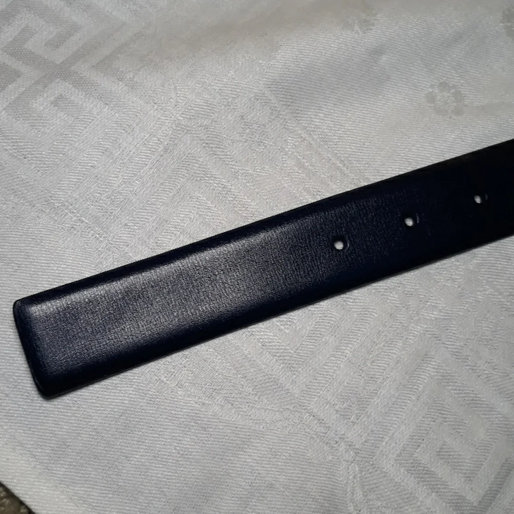 Calvin Klein dark blue leather belt. 34 inches long